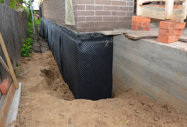 Happy homeowners after waterproofing job in Kiel